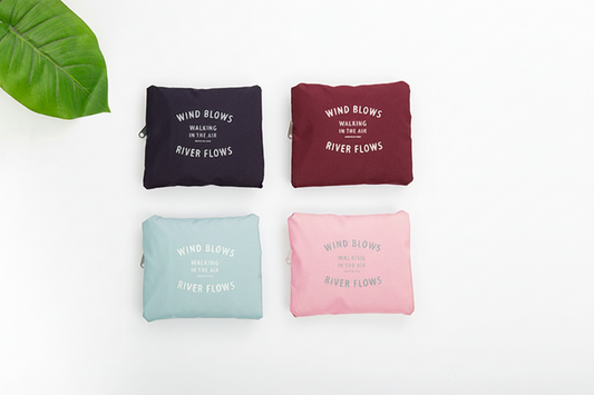 Four pouches in black, red, blue, and pink with text on a white background.