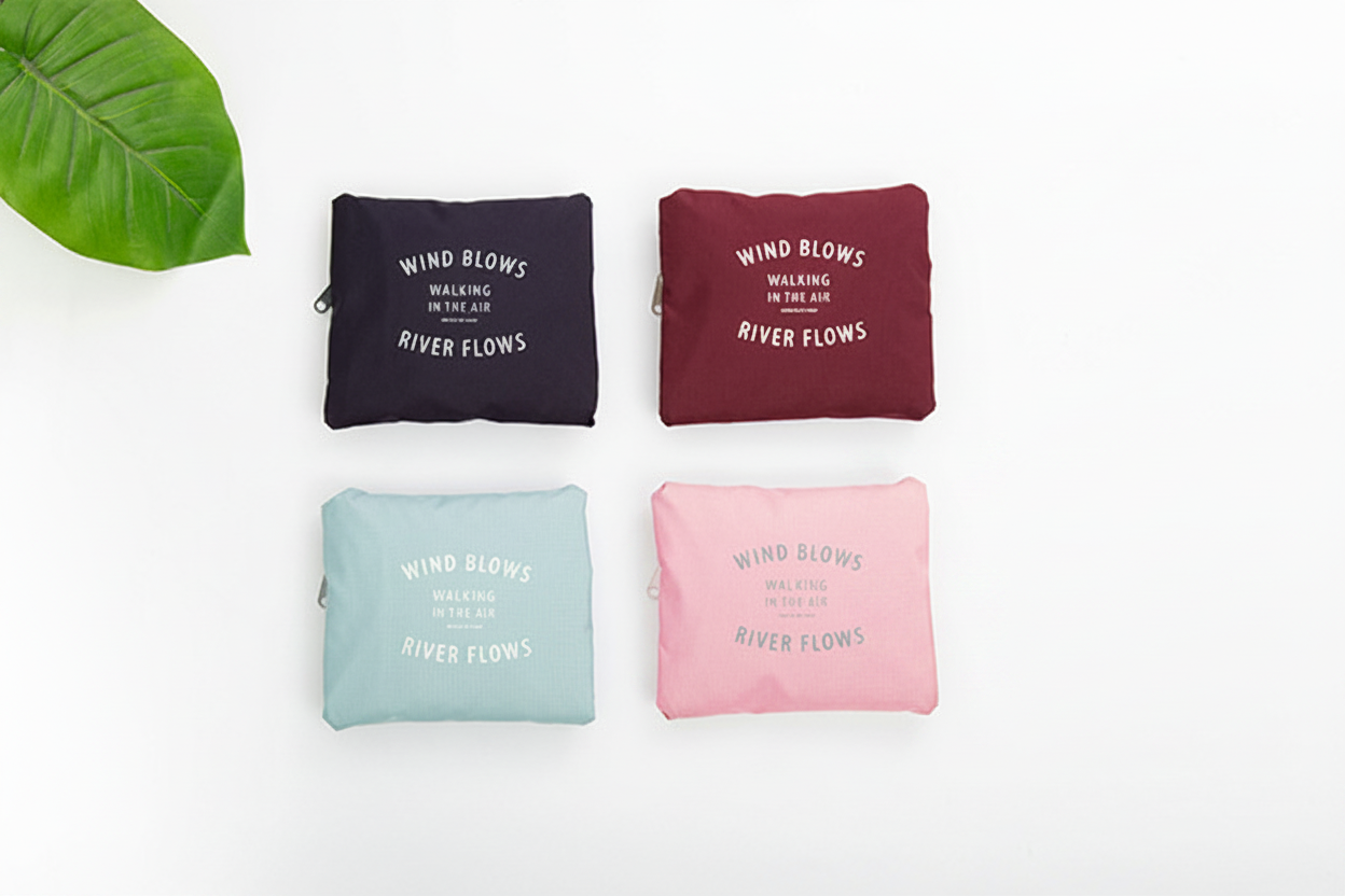 Four pouches in black, red, blue, and pink with text on a white background.